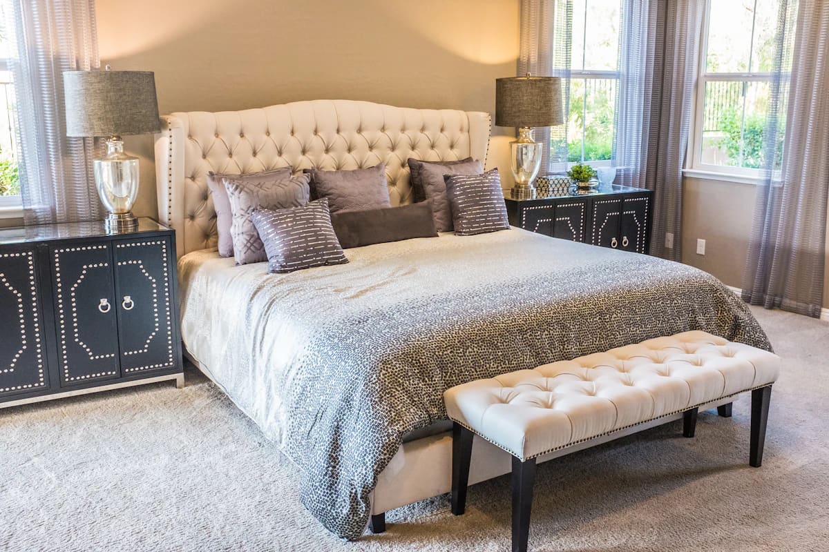 Beige button-tufted upholstered bed