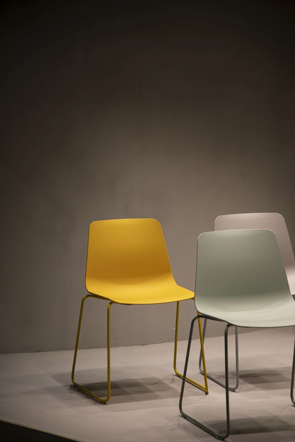 Ochre and sage stacking chairs