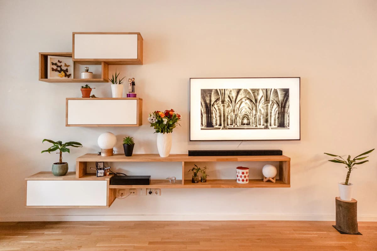 Modular oak wall shelves around a television